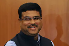 A smiling man with dark hair.