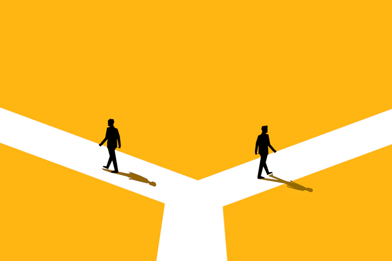 illustration of two silhouetted businessmen walking away from each other down separate paths of a fork in the road against a yellow background