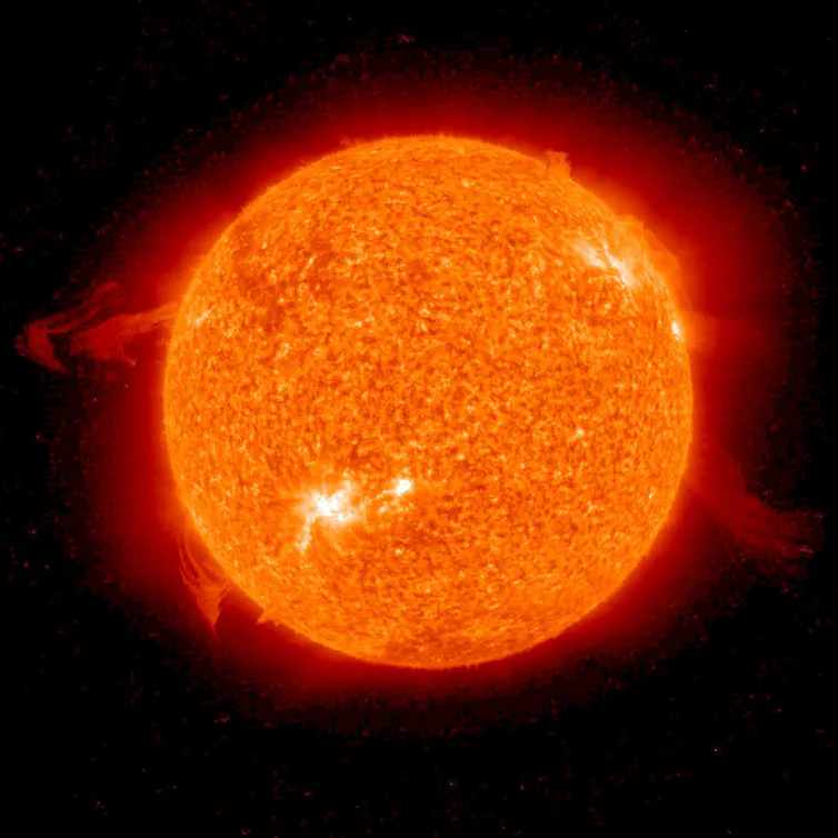 A photo of the Sun, which is a bright sphere emitting light