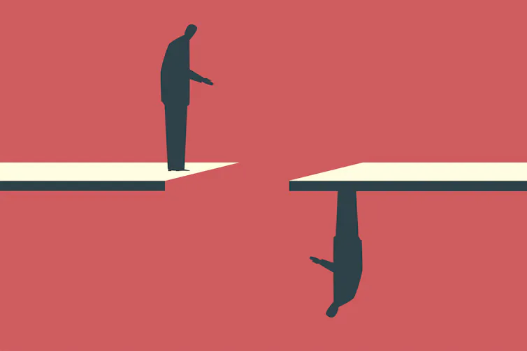 Graphic on a red background of a silhouetted businessman standing on a white ledge, looking across a gap at another businessman standing upside-down on an opposing ledge
