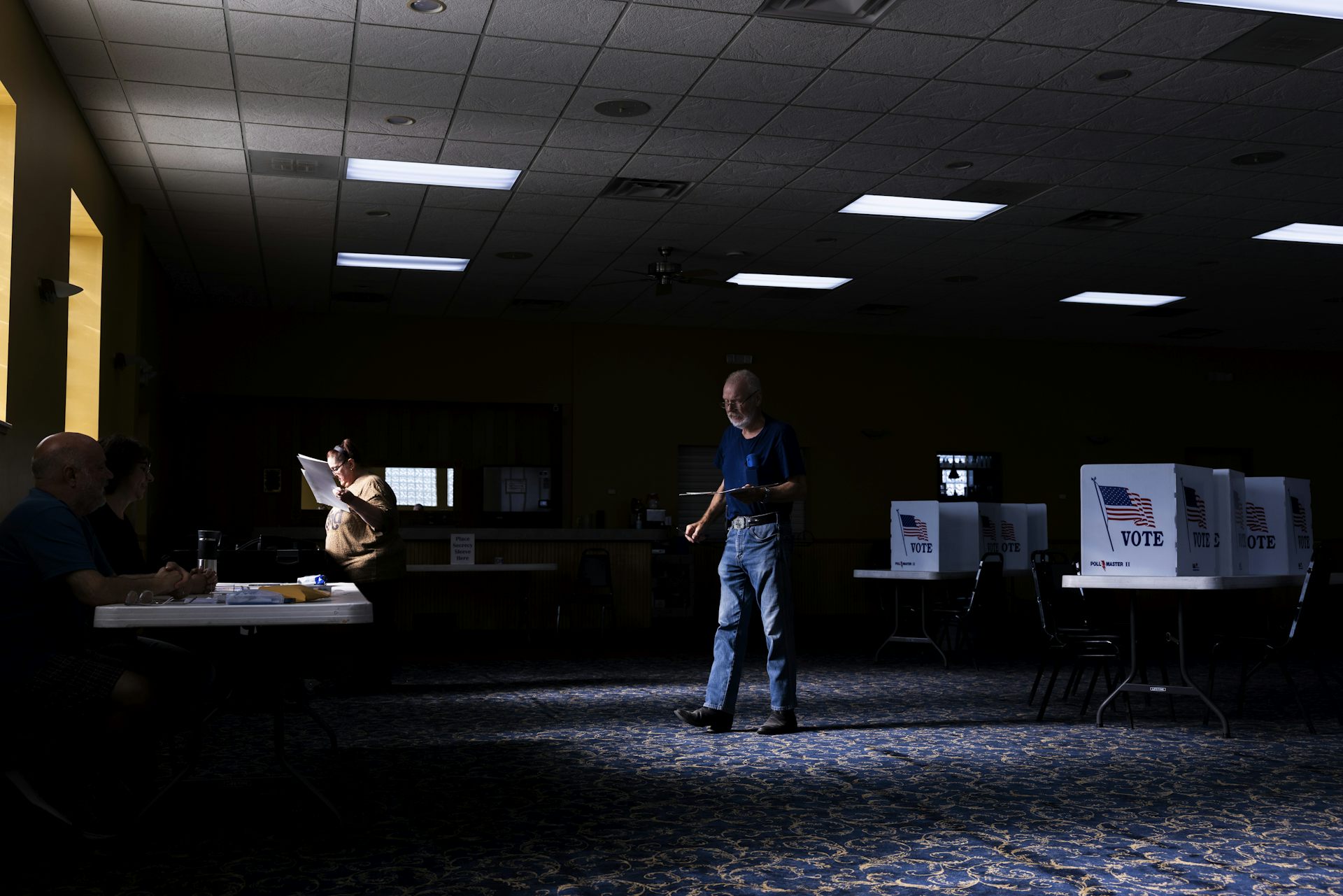 Man stands holding paper