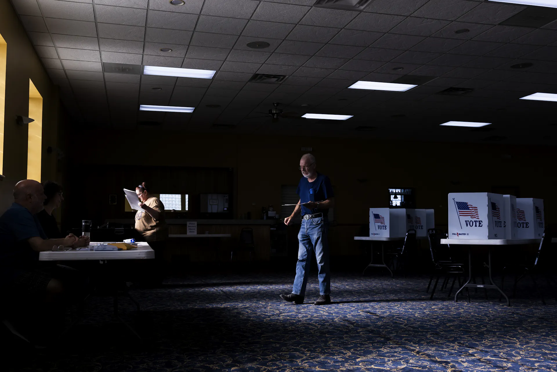 Man stands holding paper