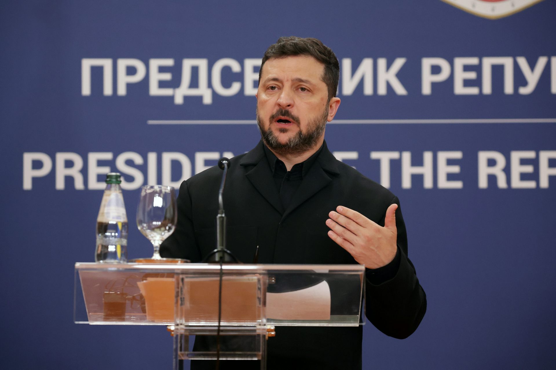 Ukrainian president Volodymyr Zelensky speaks at a podium, August 2026.
