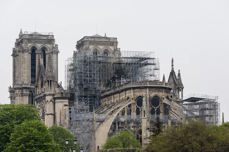 Notre Dame cathedral, its wooden spires gone, after the fire.