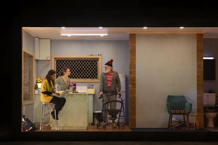 Production image: a family in a kitchen.