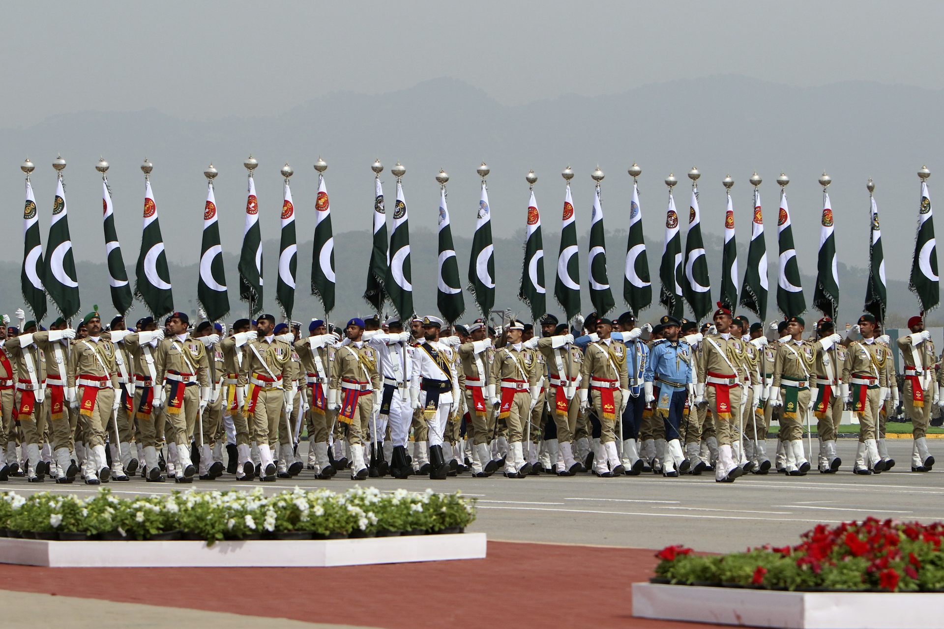 Troops march in a parade.