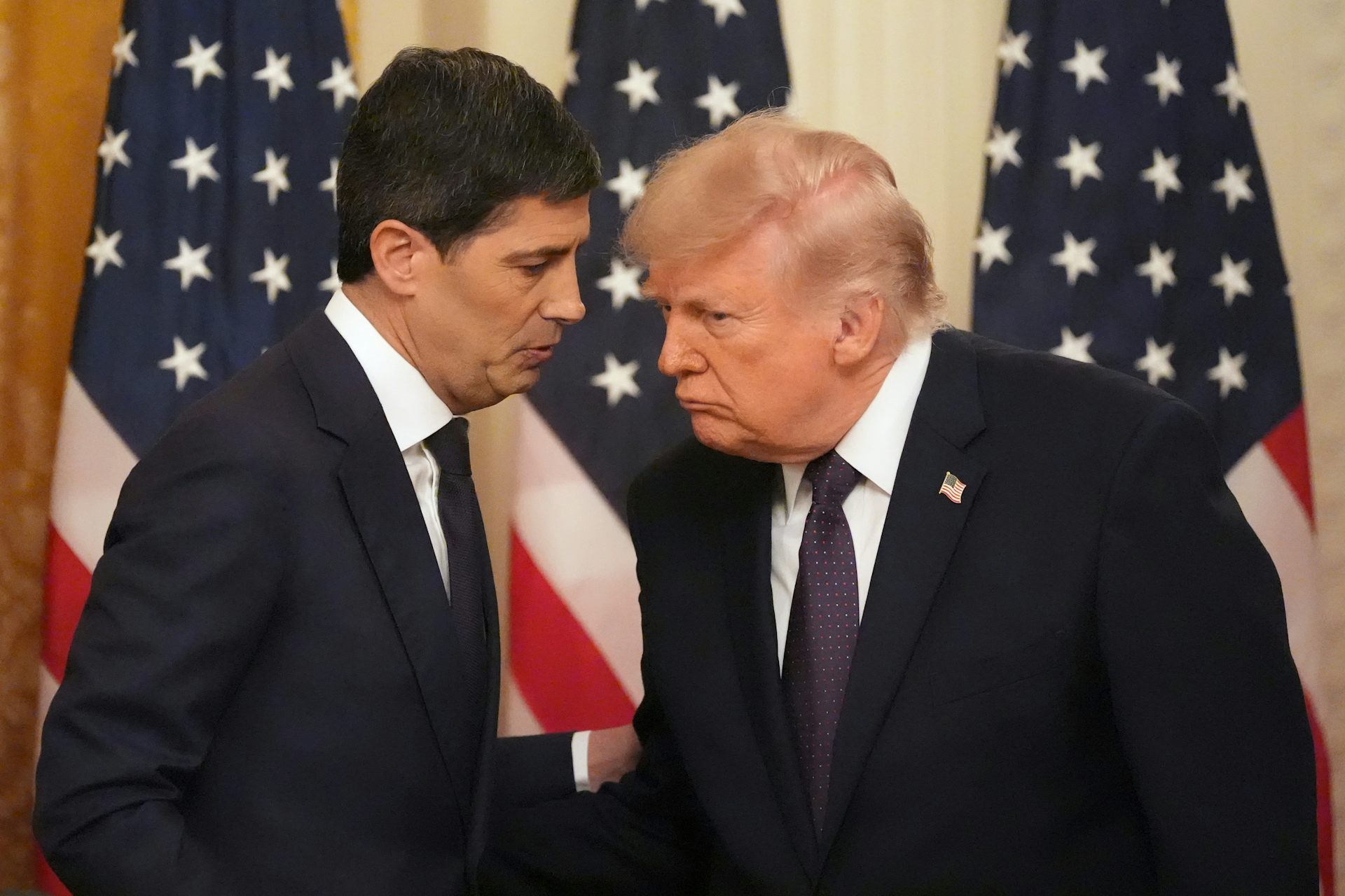 President Donald Trump speaks with Federal Reserve Chairman Kevin Warsh during Warsh's swearing-in on May 22, 2026.