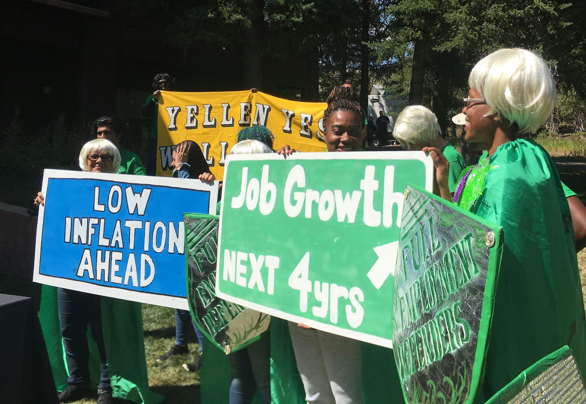 Activists with the left-leaning Fed Up coalition show support for then-Fed Chair Janet Yellen by wearing wigs in her hairstyle at the August 2017 Jackson Hole conference.