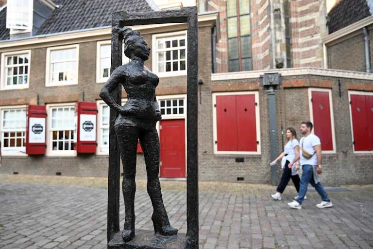 Amsterdam's Belle statue by Els Rijerse at Oudekerksplein, dedicated in 2007 to honour sex workers globally.
