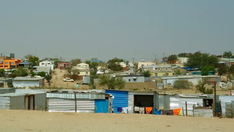 Corrugated metal structures and other housing in a sandy environment