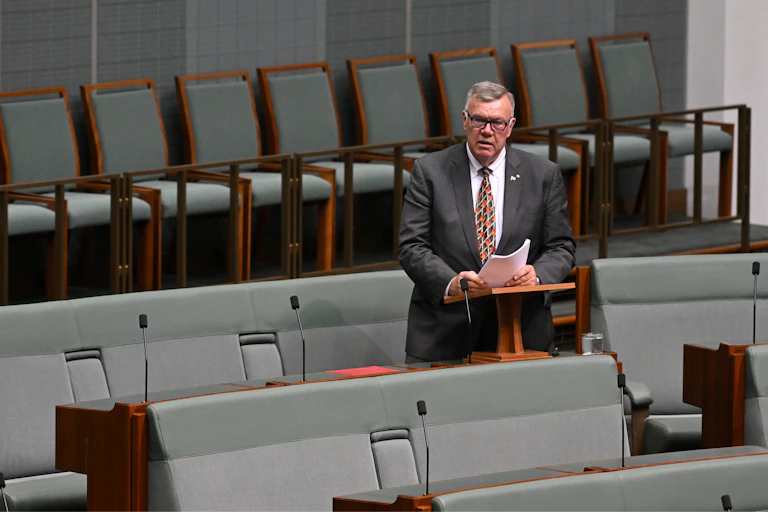David Farley standing up delivering a speech in Parliament House