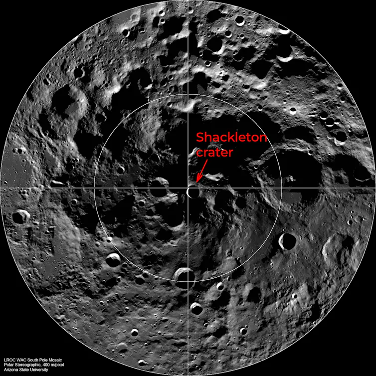 A circle view of a grey pockmarked surface showing the Shackleton crater next to the centre.