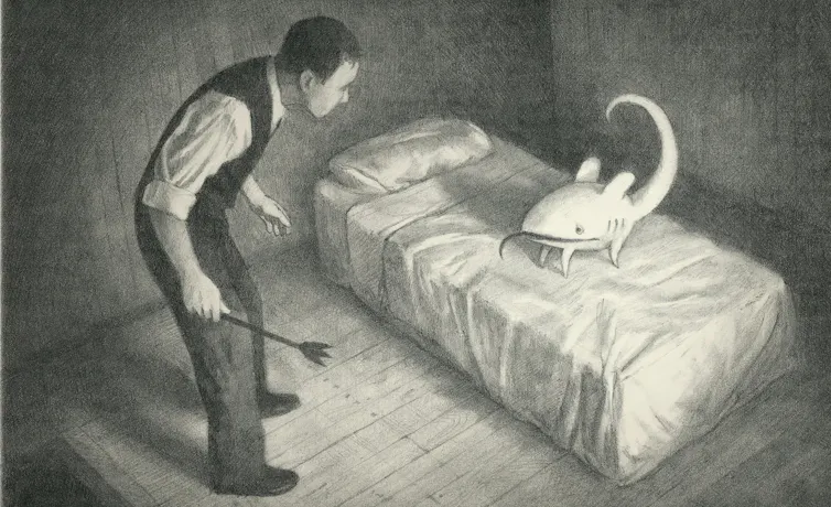 A suited man standing over a creature on a bare bed. Both look worried.