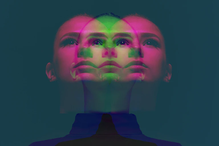 A psychedlic image of overlapping faces
