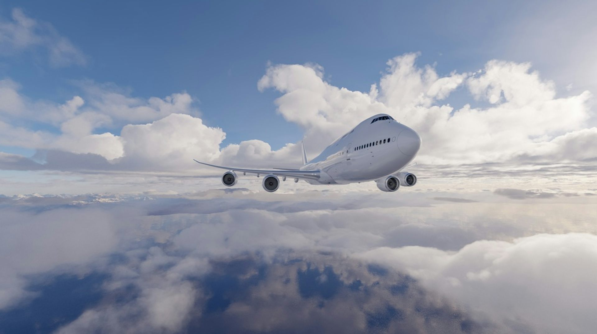 A commercial airliner flying over clouds.