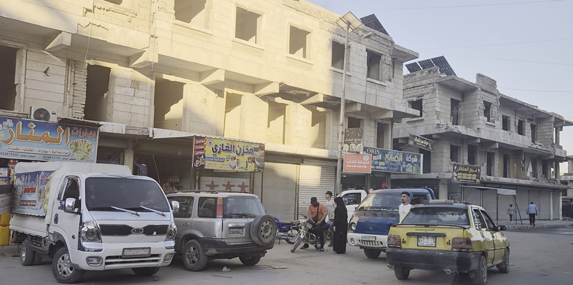 Cars parked in a busier part of Aleppo