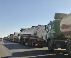 Old trucks lining the road