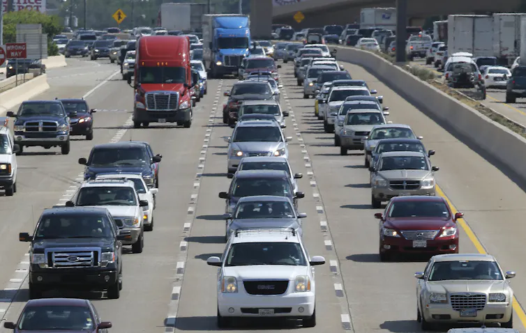 Four lanes of traffic on a highway