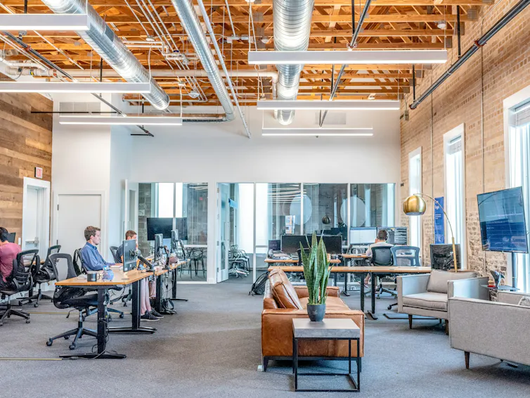 A modern office space with many empty seats.
