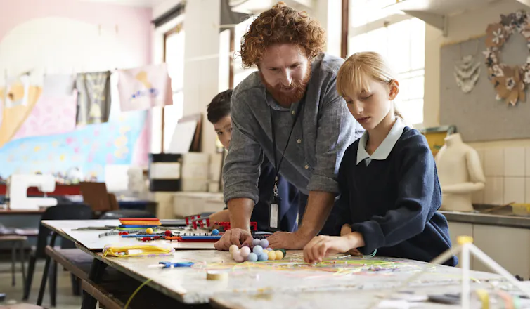 An art therapist works with a child