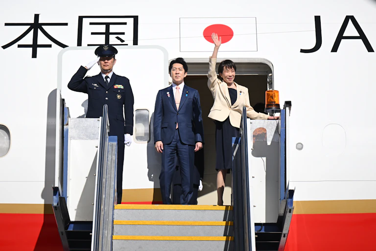 Japan's prime minister boarding an airplane.