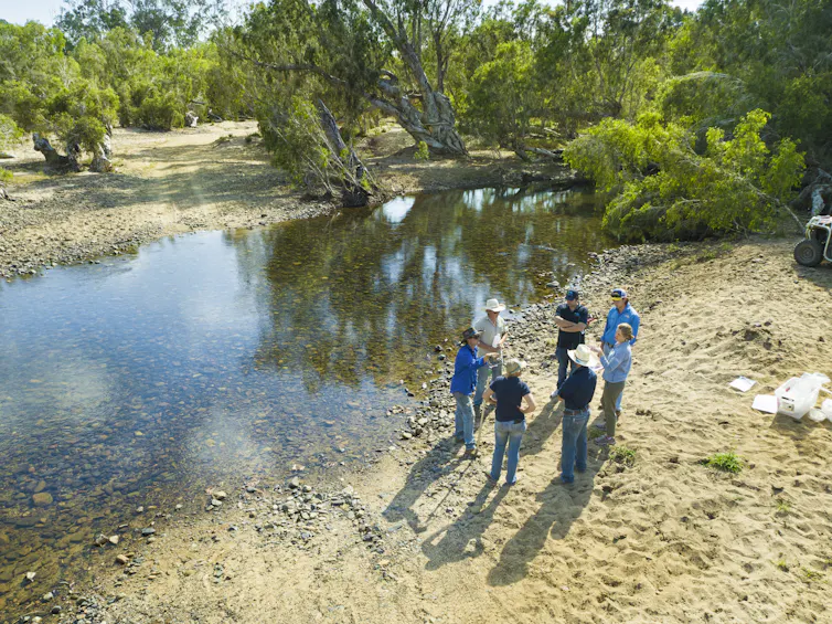 Scientists speaking with graziers about water quality results in the Burdekin catchment