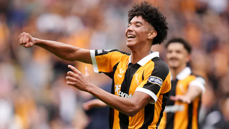 Lucas Herrington celebrates Hull's upset win against Manchester United.