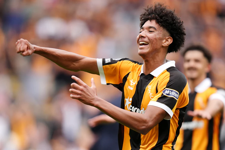 Lucas Herrington celebrates Hull's upset win against Manchester United.
