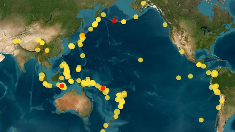 A map showing lots of yellow dots and a few red dots circled around the pacific ocean.