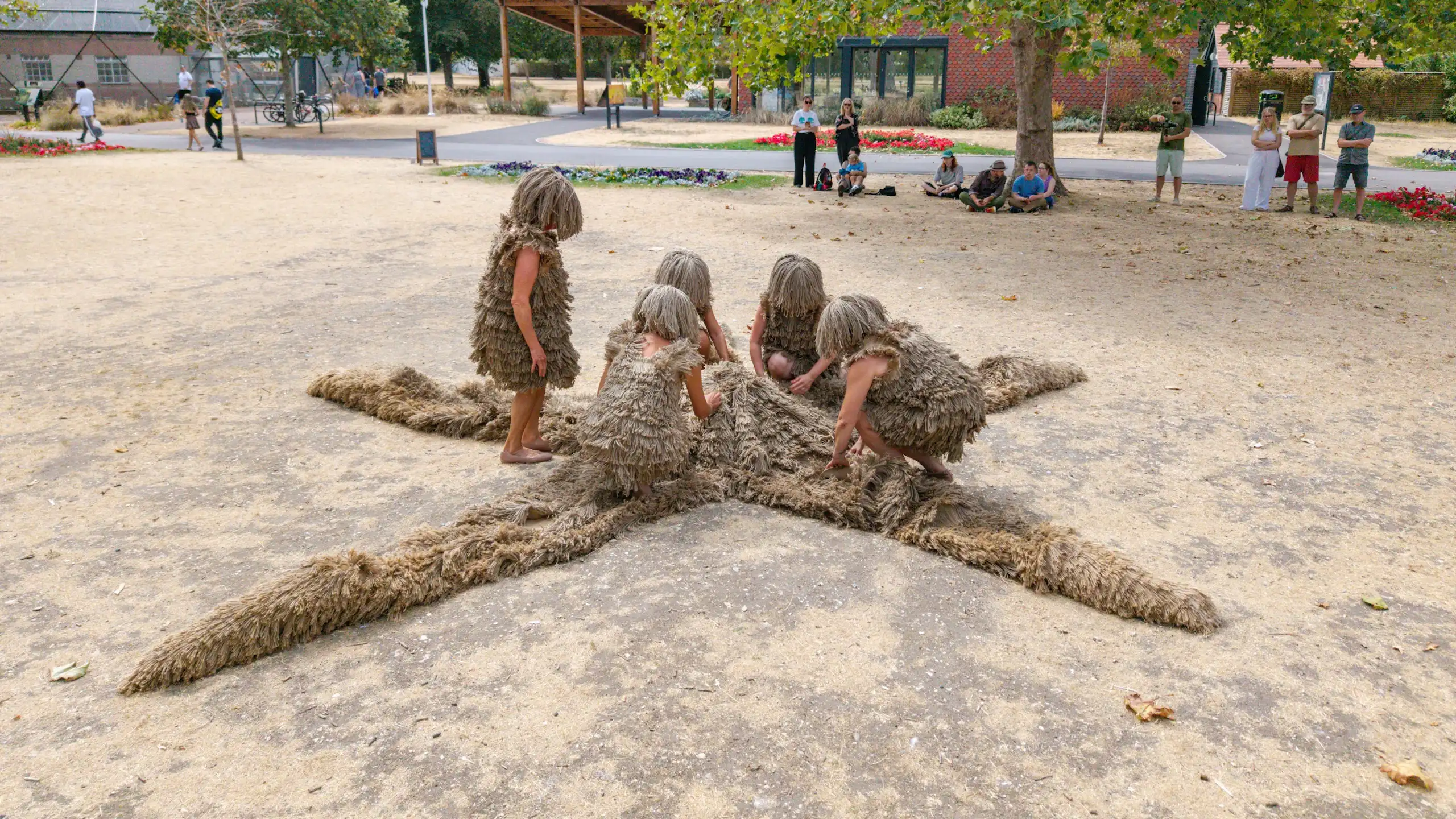 Women dressed as limbs of a starfish