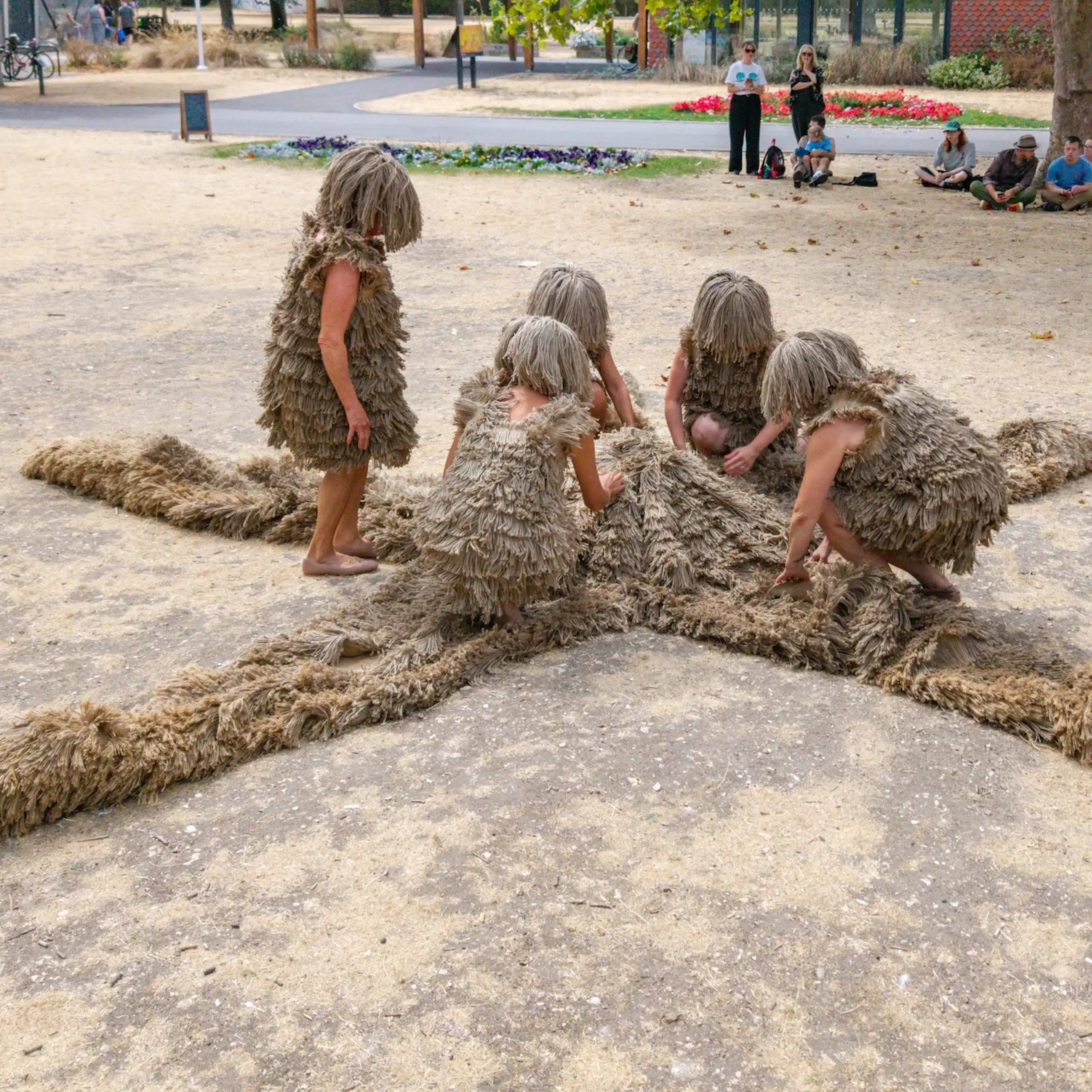 Women dressed as limbs of a starfish