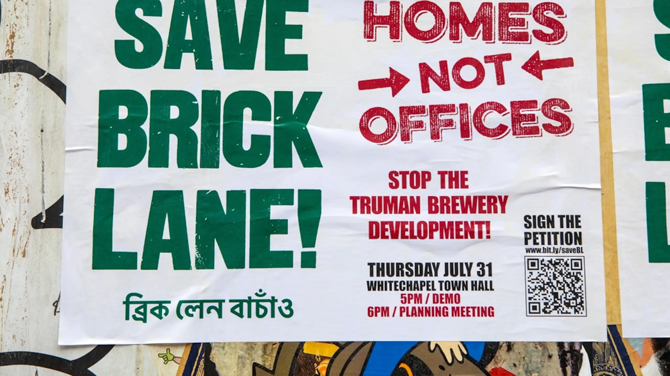 A protest banner reading 'save Brick Lane' ' homes not offices'