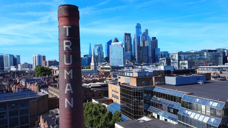 The chimney of the Truman Brewery with the City of London in the background