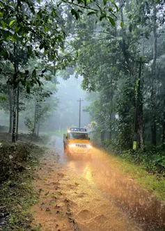car drives through heavy rain