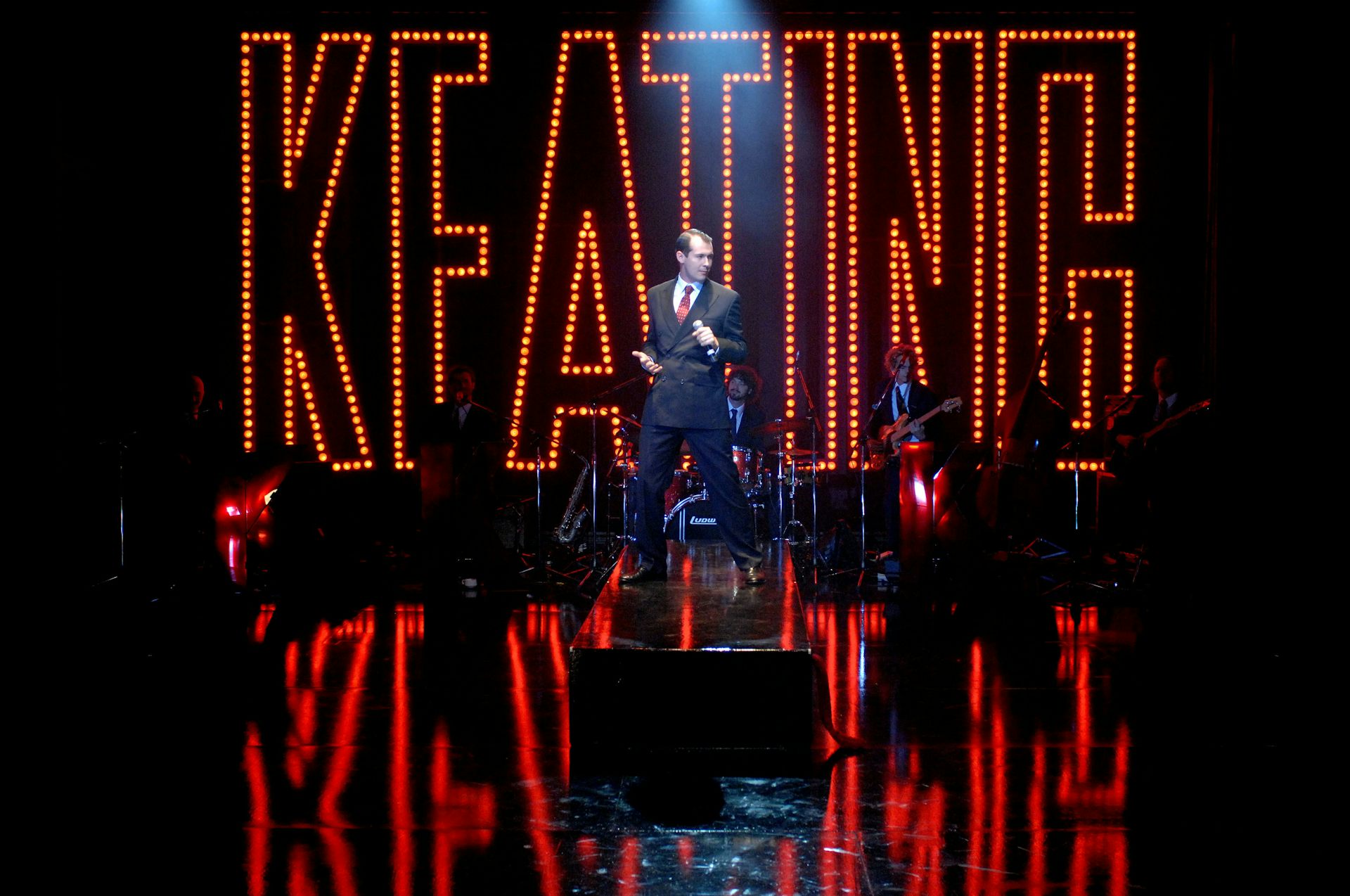 Mike McLeish performs as Paul Keating in Keating: the musical. The words 'KEATING'