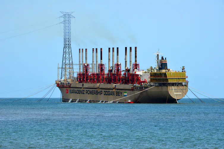 A large ship surrounded by ocean.