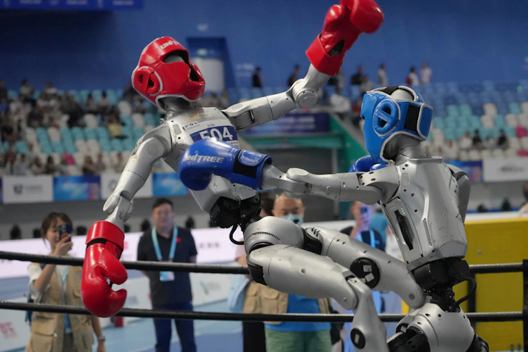 Robots compete at the free combat event of the World Humanoid Robot Games in Beijing.
