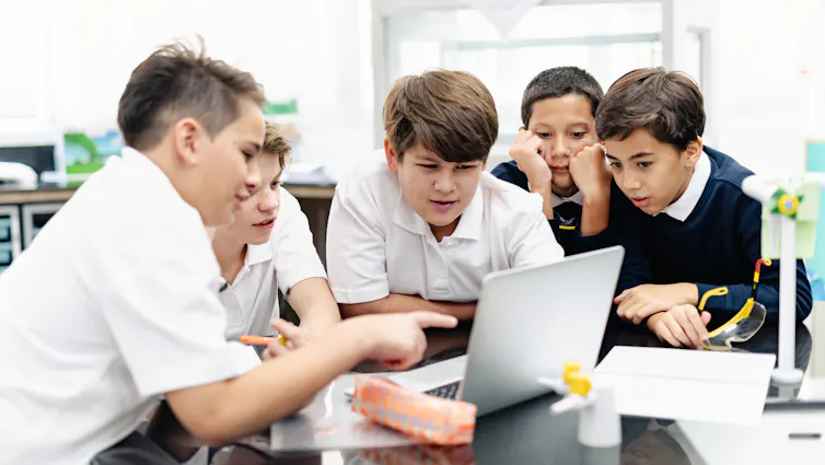 Boys talking in classroom