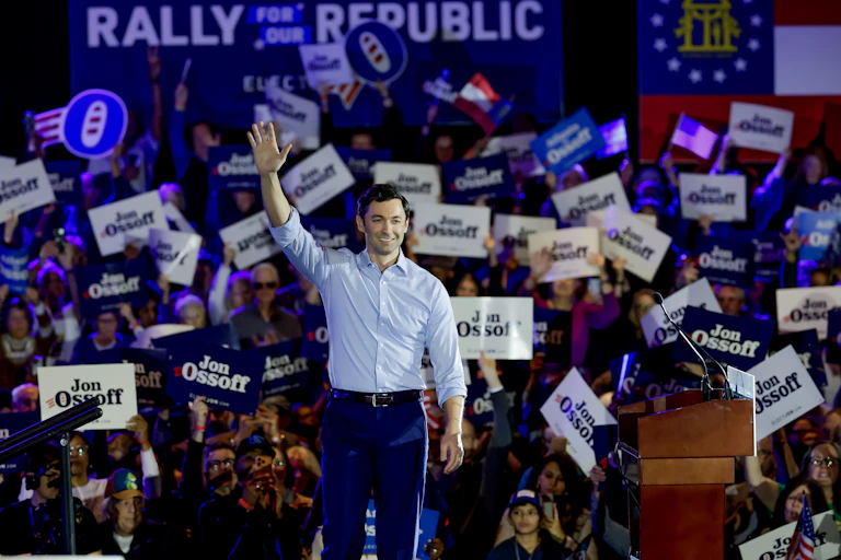 Georgia Democratic senator Jon Ossoff waves to supporters at an election rally in February 2026.