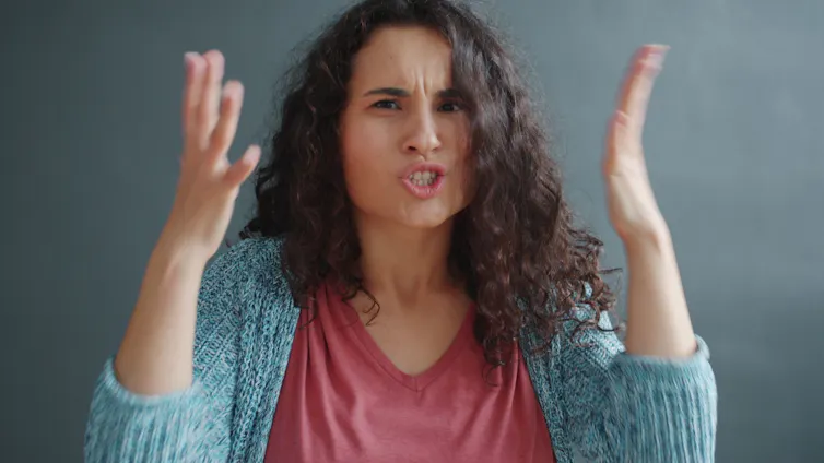 Angry woman, with hands in air