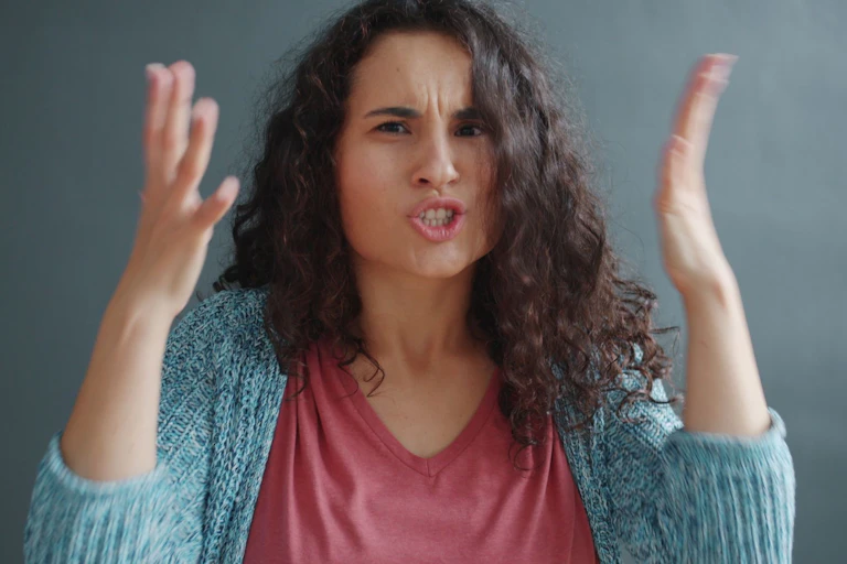 Angry woman, with hands in air