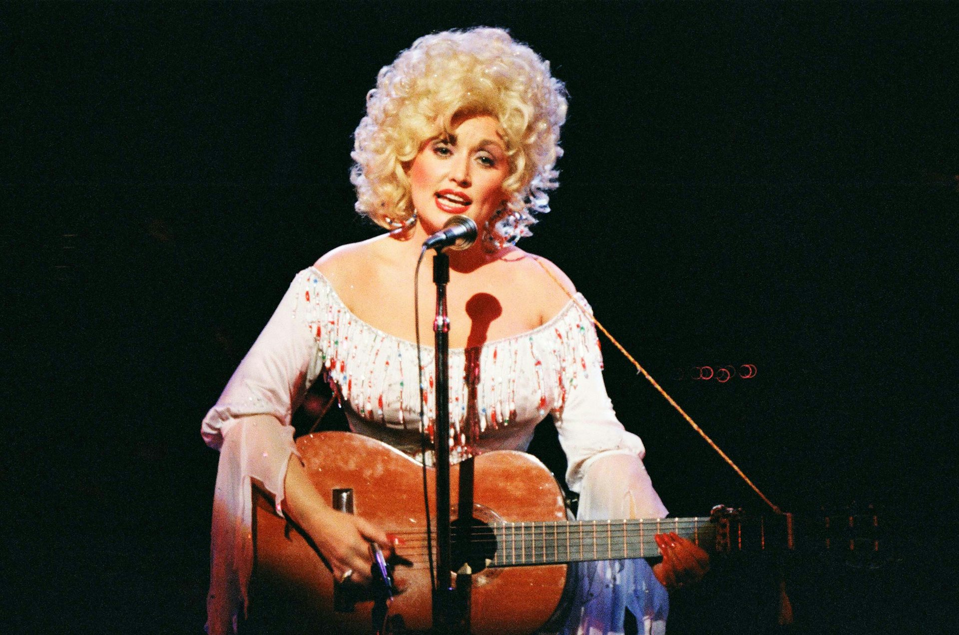 How the ‘backwoods Barbie’ Dolly Parton turned self-aware artifice into authentic artistry