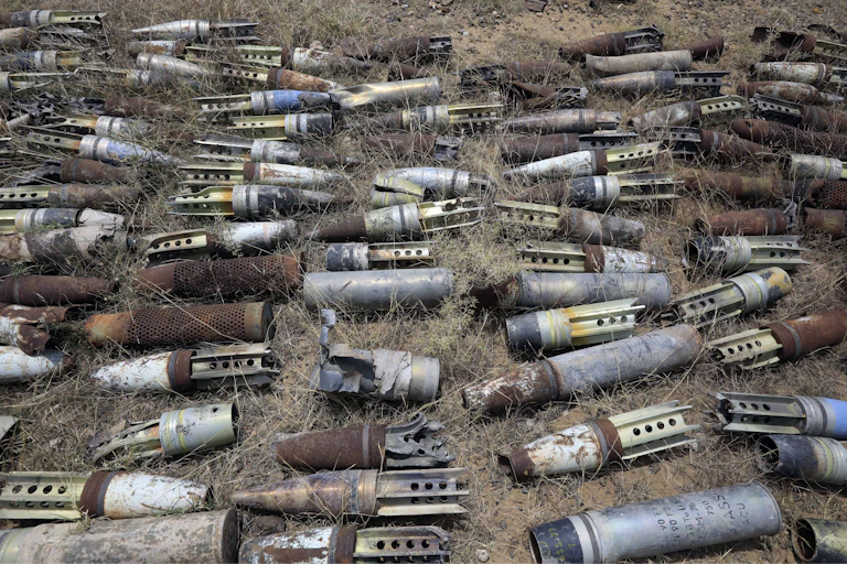 Landmines and explosive remnants of war laid out in a field in Yemen.