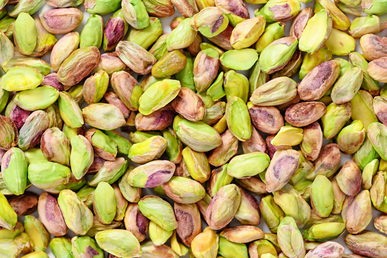 pink green peeled pistachio nuts