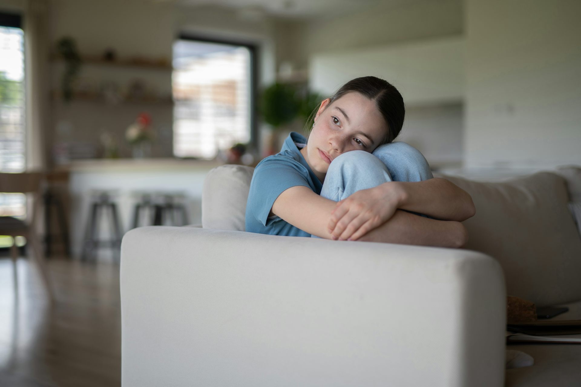 Girl alone on sofa