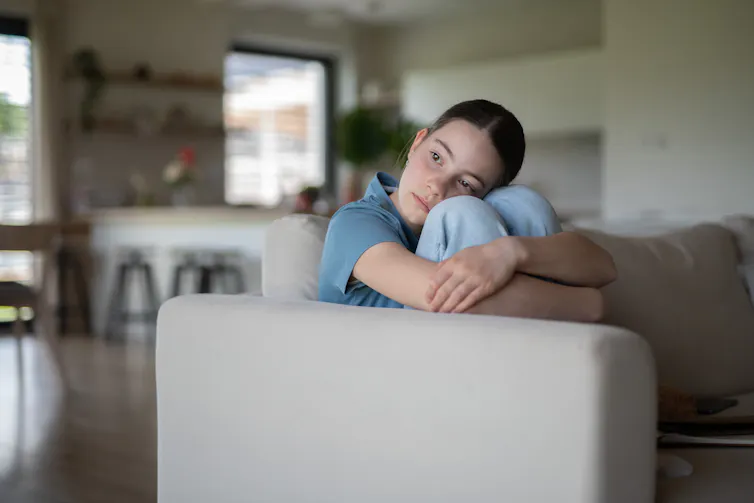 Girl alone on sofa