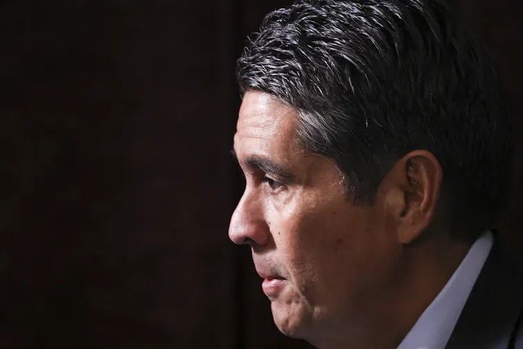 A close up headshot of Palau president Surangel Whipps Jr in a dark suit with a white collar.