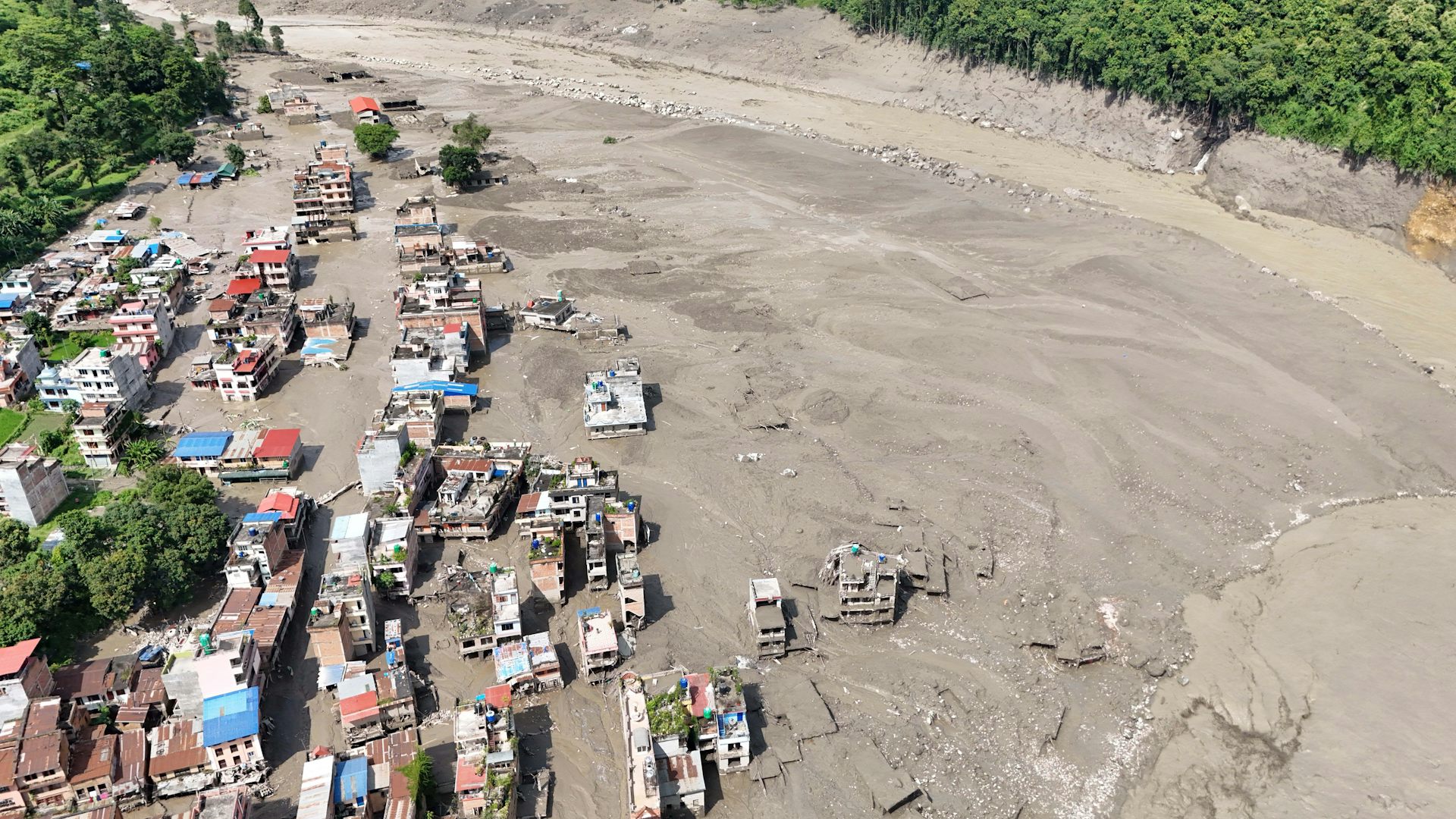 Aerial view over the Trishuli River following a massive flash flood triggered by an avalanche of ice and rock.