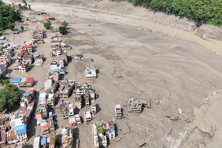 Aerial view over the Trishuli River following a massive flash flood triggered by an avalanche of ice and rock.