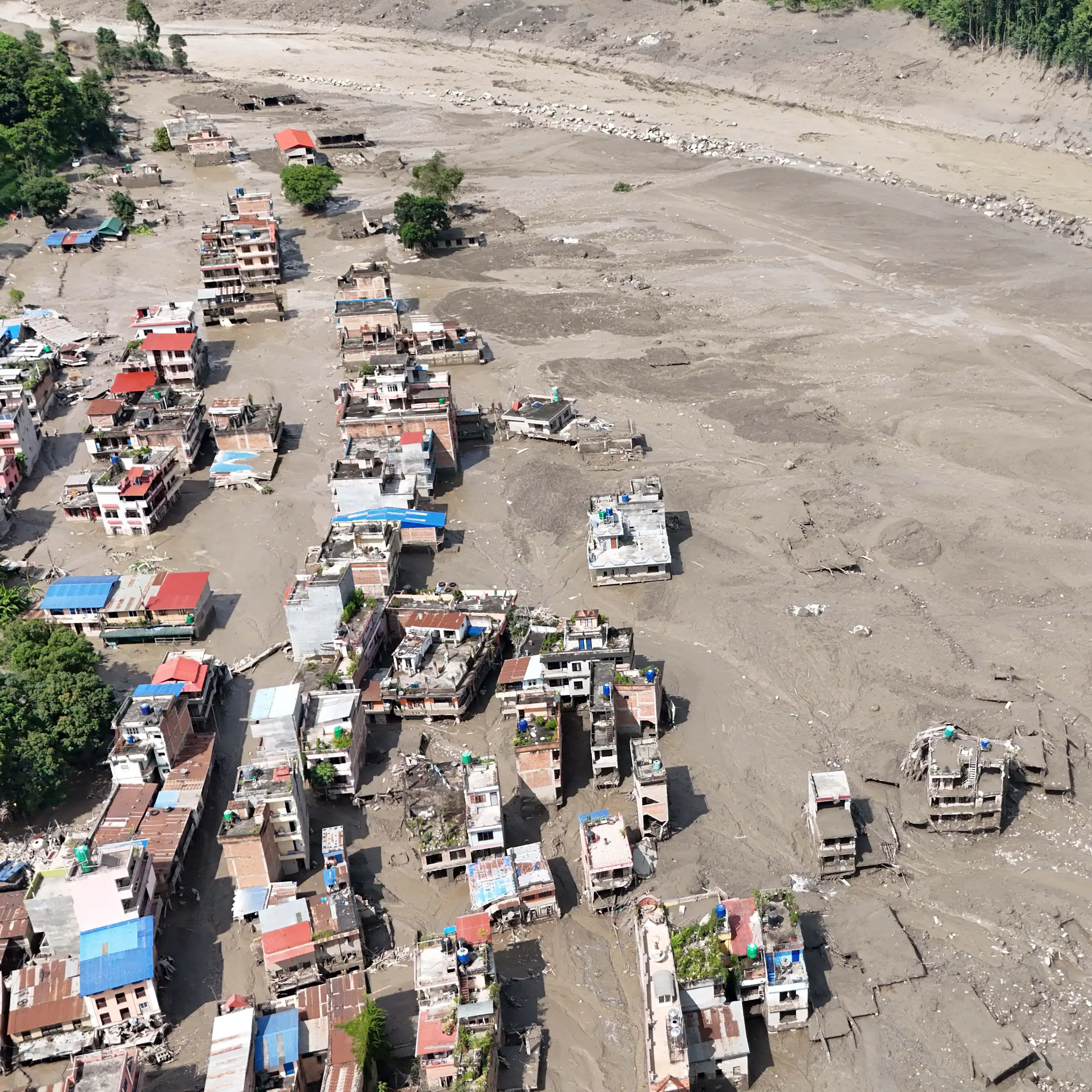 Aerial view over the Trishuli River following a massive flash flood triggered by an avalanche of ice and rock.
